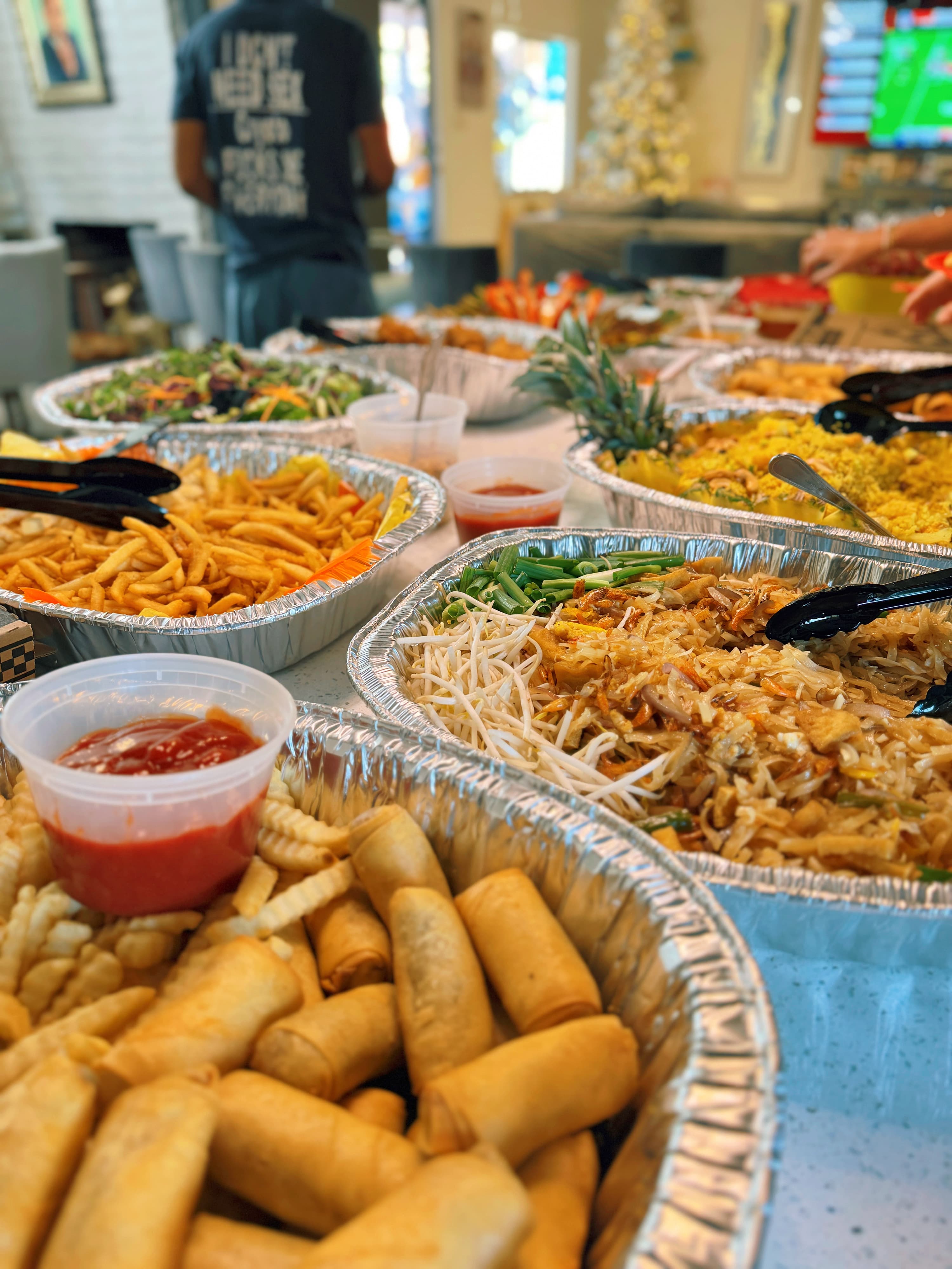 Beautiful catering spread showcasing variety of Thai dishes