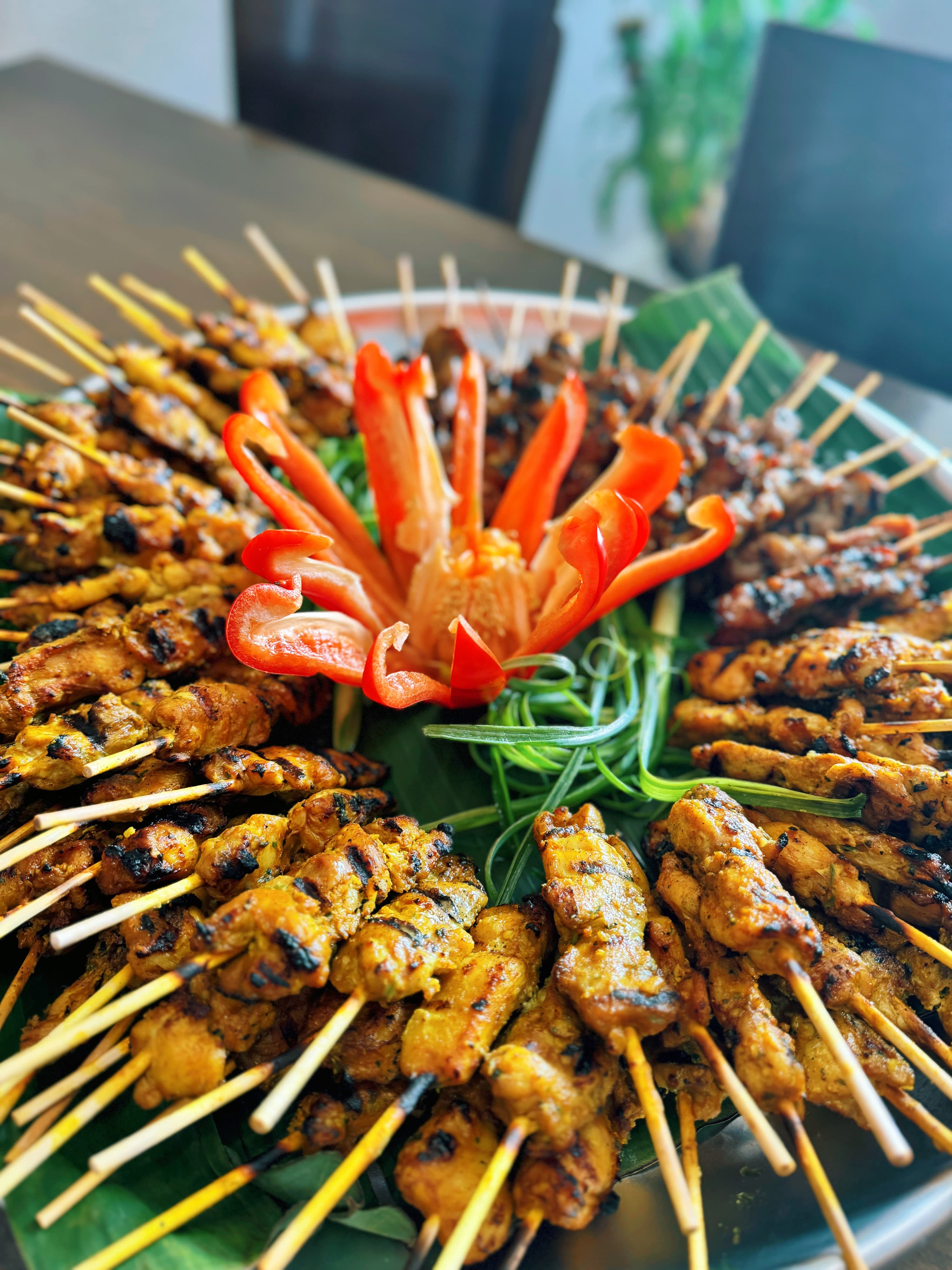 Delicious chicken satay skewers ready for catering