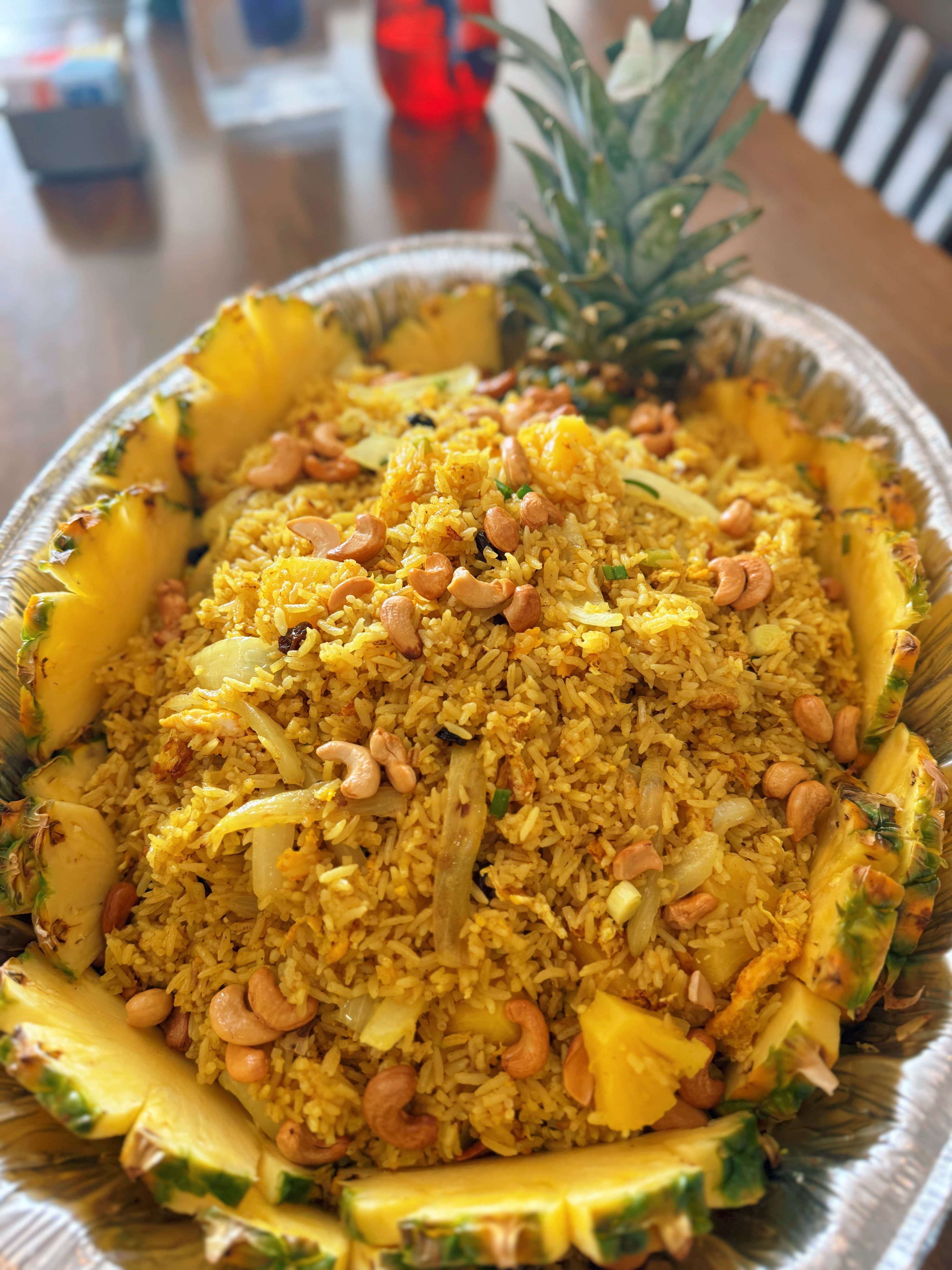 Colorful pineapple fried rice in catering presentation